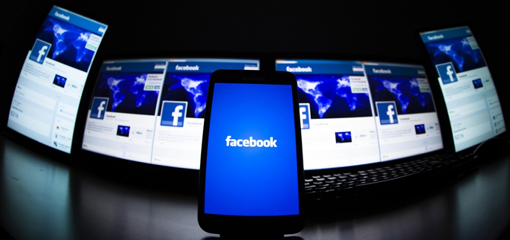 The loading screen of the Facebook application on a mobile phone is seen in this photo illustration taken in Lavigny