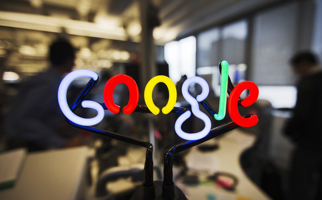A neon Google logo is seen at the new Google office in Toronto