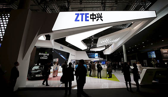 File photo of visitors attending the ZTE stand at the Mobile World Congress in Barcelona